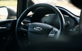 The steering wheel of a Ford car